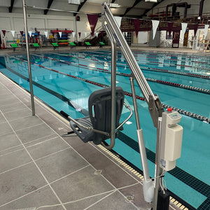 Spectrum Aquatics Motion Trek BP350 ADA pool lift — installed on a pool deck