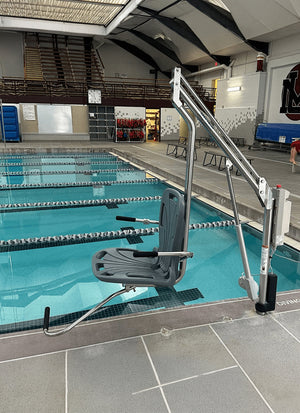 Spectrum Aquatics Motion Trek BP350 ADA pool lift — poolside lifestyle view