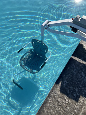 Spectrum Aquatics Aqua Buddy V2 ADA pool lift — seat lowered into water