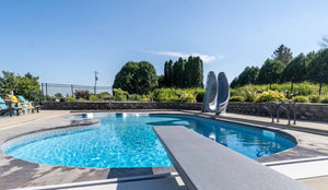 Global Pool Products GX diving board on 3-bolt base by the pool