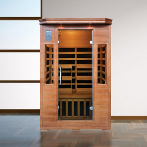 HeatWave Majestic Sauna - two-person cabin lit inside, installed against a panelled wall