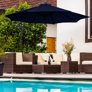 Island Umbrella Captiva Cantilever Umbrella - navy canopy cantilevered over a poolside rattan set