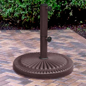Island Umbrella 66-lb Base - fluted round base holding a pole on a block-paved patio