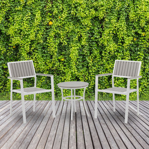 Island Retreat Tek-Wood 3-Piece Patio Set - two chairs and side table on a deck against foliage
