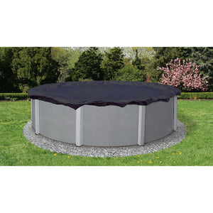 Arctic Armor 8-Year Above Ground Winter Cover - navy cover fitted over a round above-ground pool in a garden