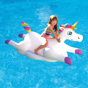 Blue Wave Cloud Rider Rainbow Unicorn Pool Float - child riding the unicorn float across a pool