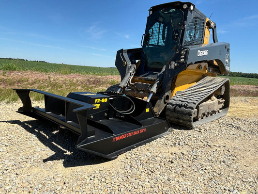 Skid steer brush cutter clearing overgrown land — Stinger Twister F2 open-front brush cutter