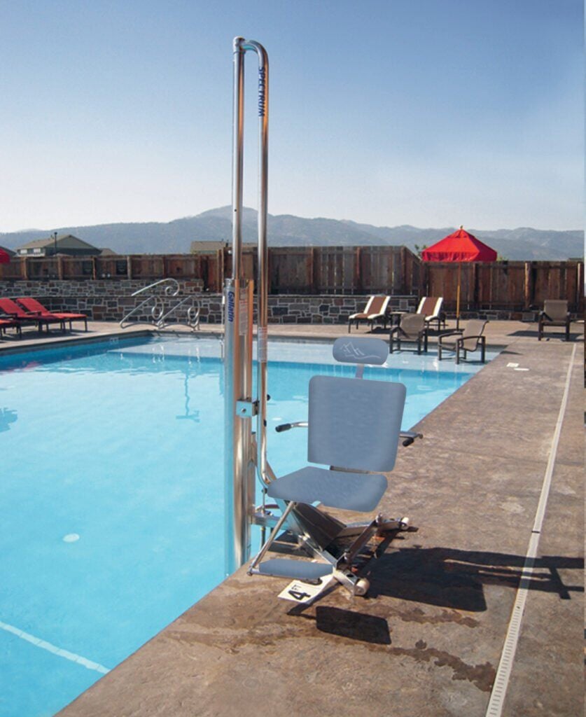 Spectrum Aquatics Gallatin WP400 water-powered pool lift — lift with grey seat at poolside