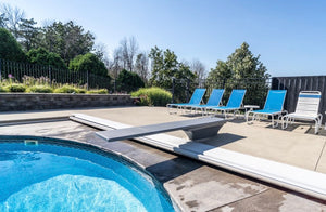 Global Pool Products GX diving board installed at a backyard pool
