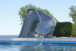 Global Pool Products Splash pool slide installed beside a pool