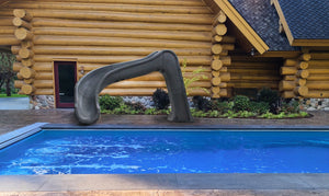 Global Pool Products Side Winder pool slide installed on a pool deck