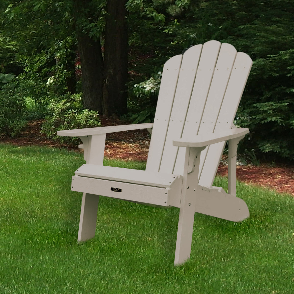 Island Retreat Tek-Wood Adirondack Chair - chair set on a lawn, three-quarter view from the front