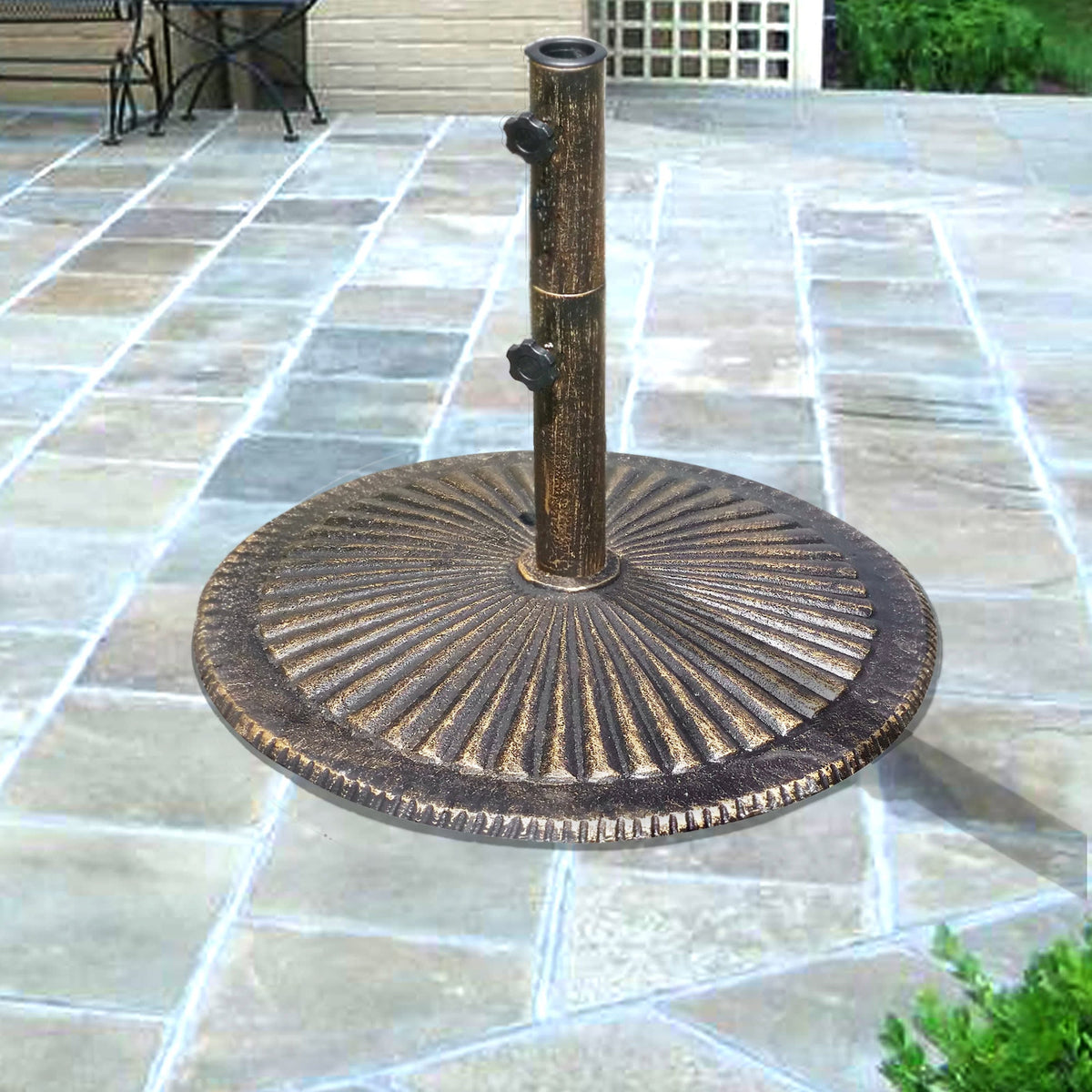 Island Umbrella Classic Cast Iron Base - fluted bronze base with twin knobs on a stone patio