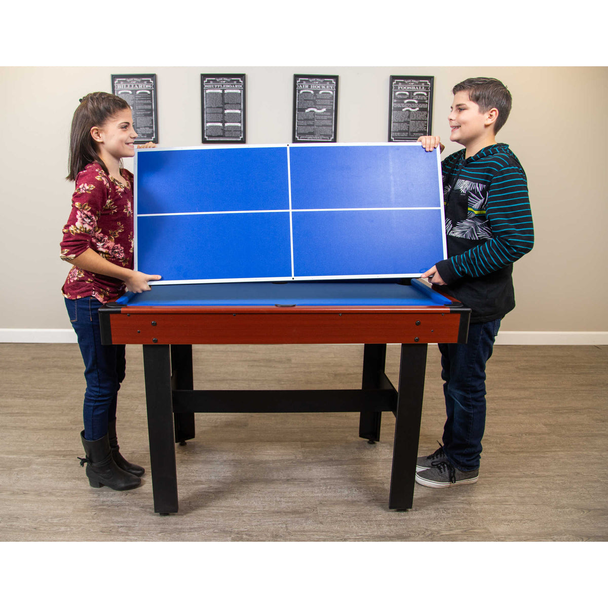 Hathaway Triad Multi-Game Table - two children lifting the table tennis top into place