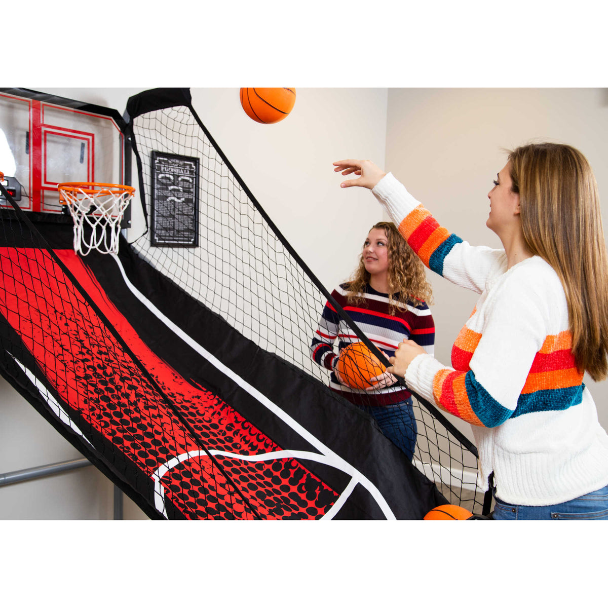 Hathaway Shot Pro Basketball Arcade - player shooting while a second waits with the spare ball