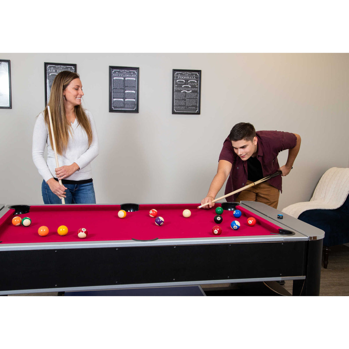 Hathaway Triple Threat Multi-Game Table - two players at the red pool bed with the table rotated