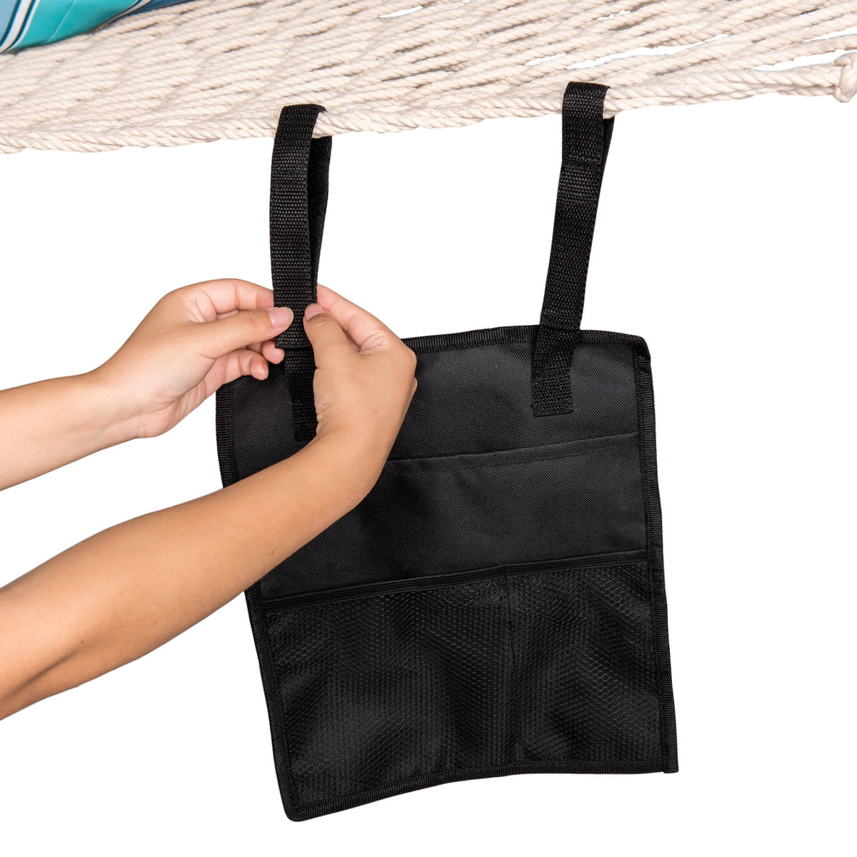 Island Umbrella Hammock Organizer - hands fastening the hook-and-loop strap over the hammock rope