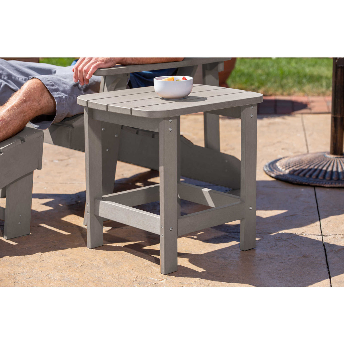 Island Retreat Adirondack Side Table, Slate Grey - table in use beside an Adirondack chair