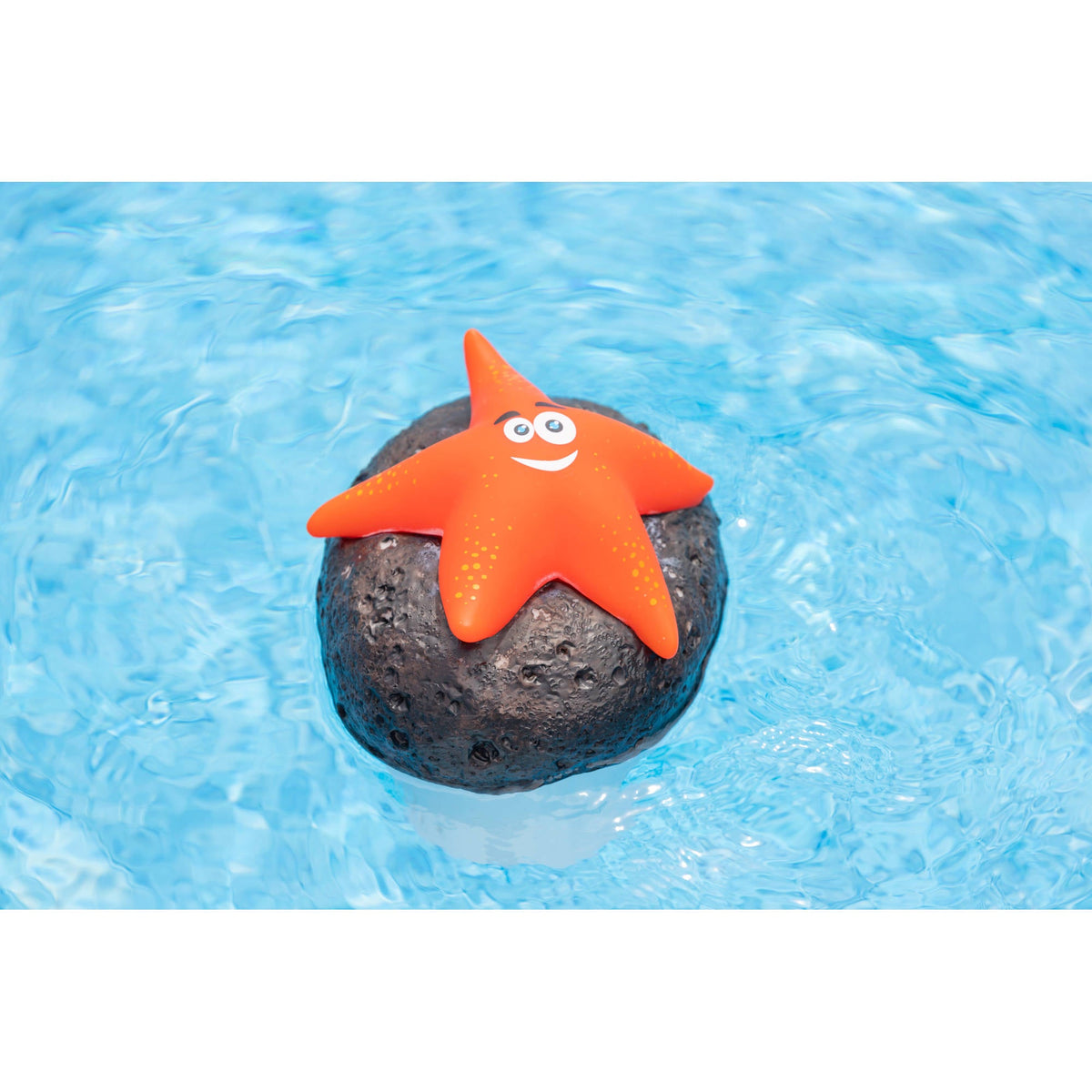 Blue Wave Starfish Floating Chlorine Dispenser, Orange - dispenser floating on the pool surface