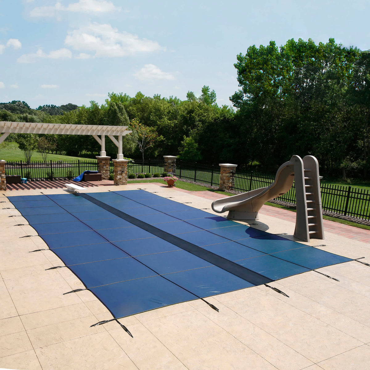 Arctic Armor 20-Year Ultra Light Solid In-Ground Pool Safety Cover Pool Cover — shown in use