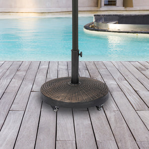 Island Umbrella 50-lb Wheeled Base - round wicker-pattern base on a deck beside a pool