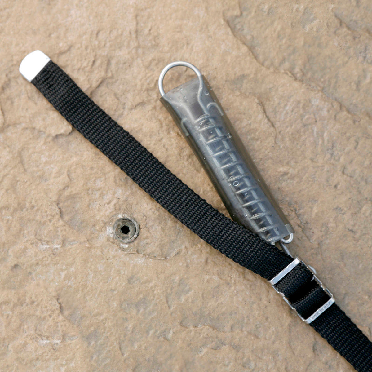 Arctic Armor 20-Year Ultra Light Solid Safety Cover w/ Step Section - strap anchored to a brass deck anchor