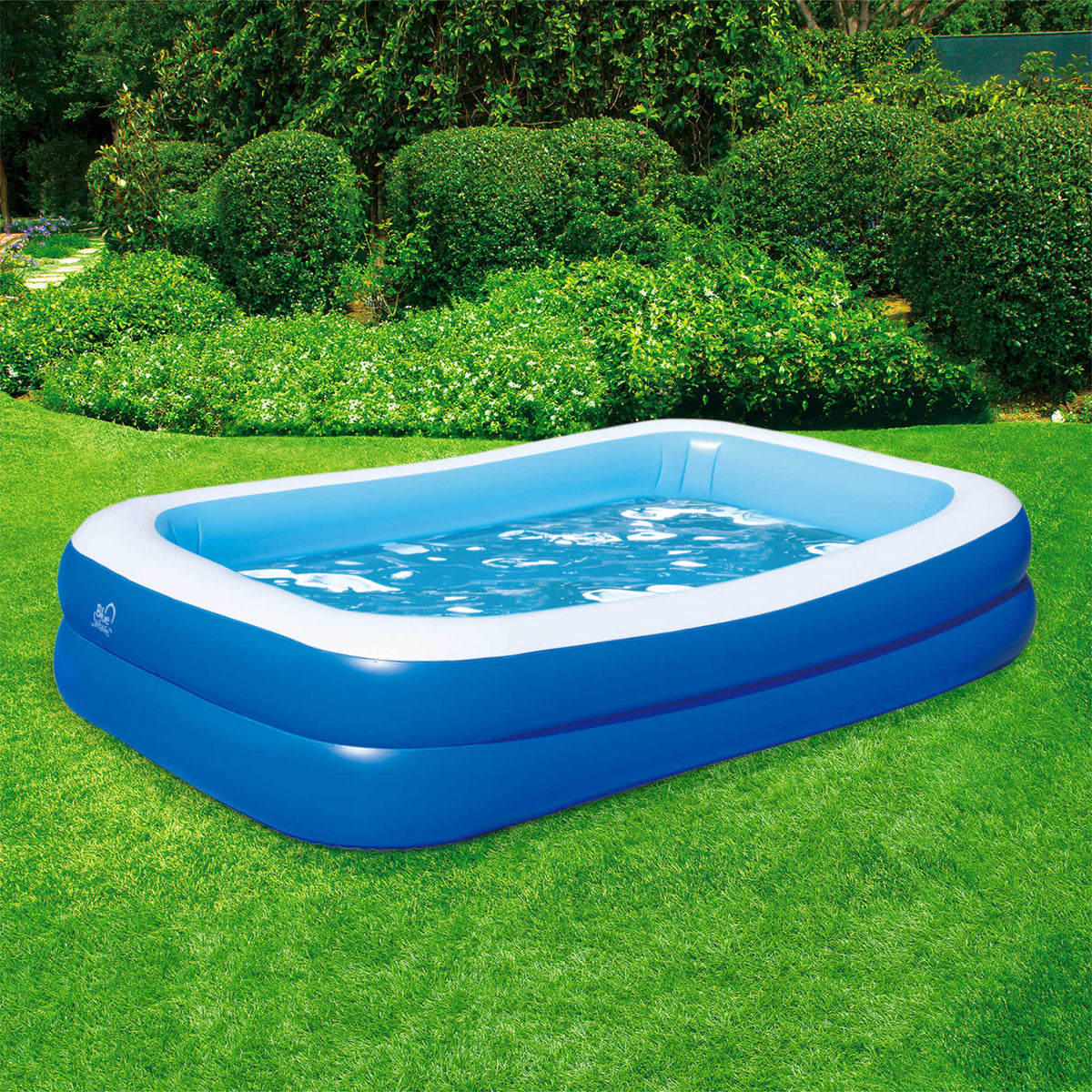 Blue Wave Inflatable Rectangular Family Pool - filled and set up on a lawn, seen from the side