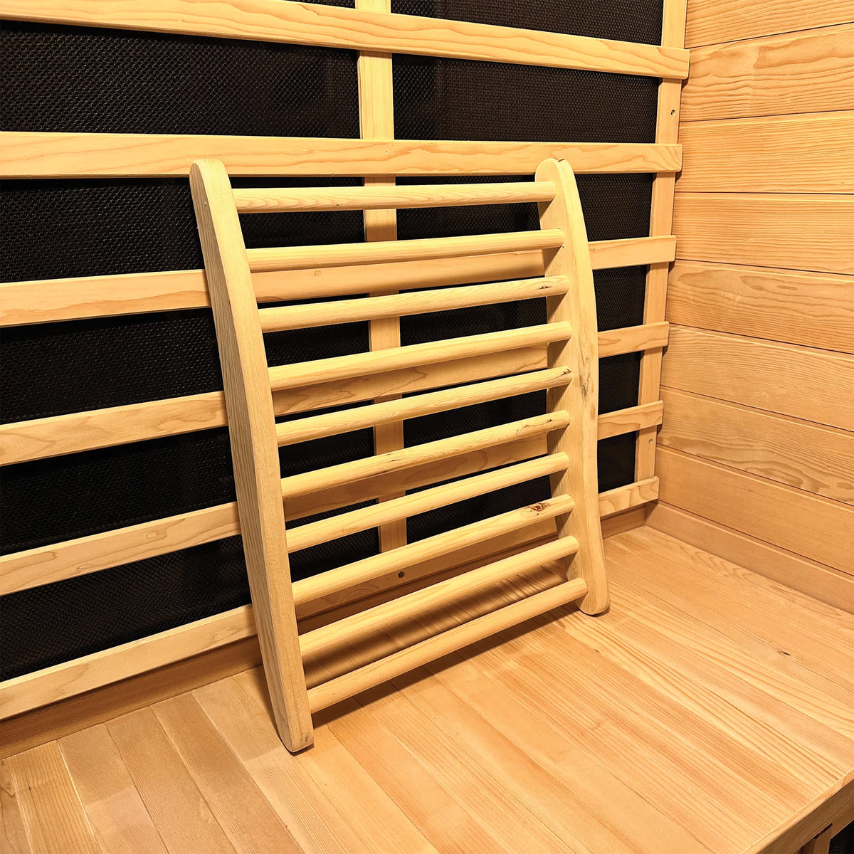 HeatWave Deluxe Sauna Accessory Kit - curved hemlock backrest resting against the cabin wall