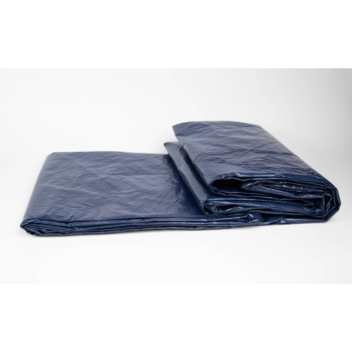 Arctic Armor 8-Year In-Ground Winter Cover - cover folded for storage, showing the navy laminated face