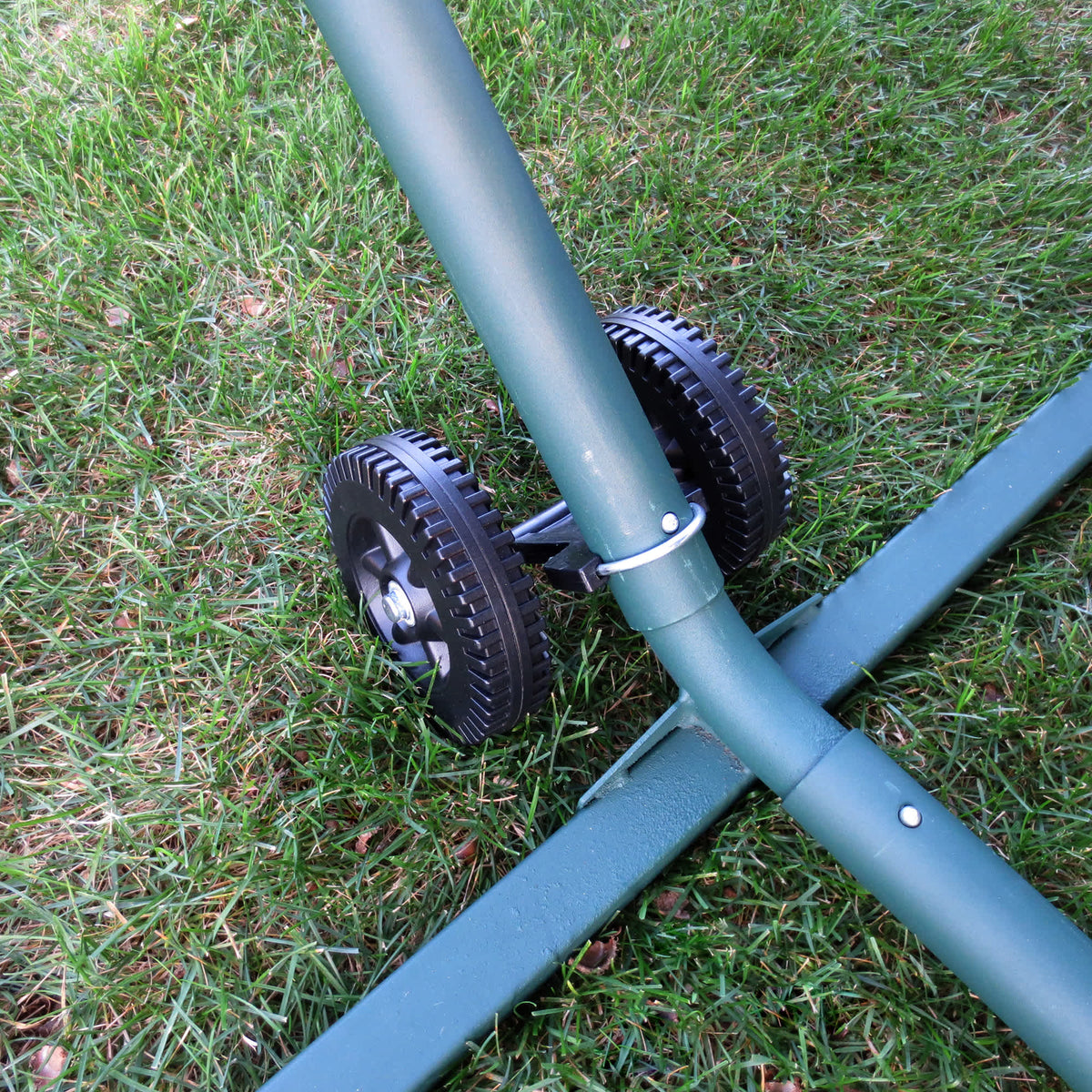 Island Umbrella Hammock Wheel Set - wheels clamped to a green hammock stand leg on grass