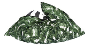 Ledge Lounger Laze Pillow pool float pillow — bold jungle pattern on the water