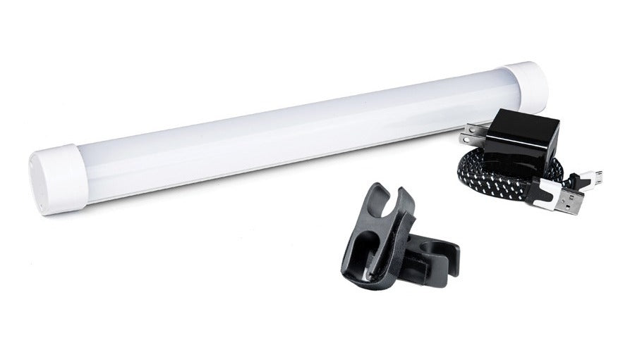 Ledge Lounger umbrella light — fitted under an open canopy at dusk