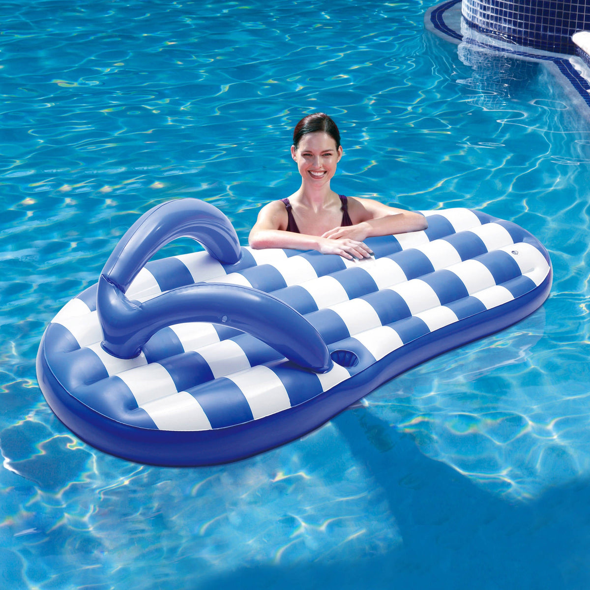 Blue Wave Marine Blue Flip Flop Pool Float - swimmer resting against the float in a pool
