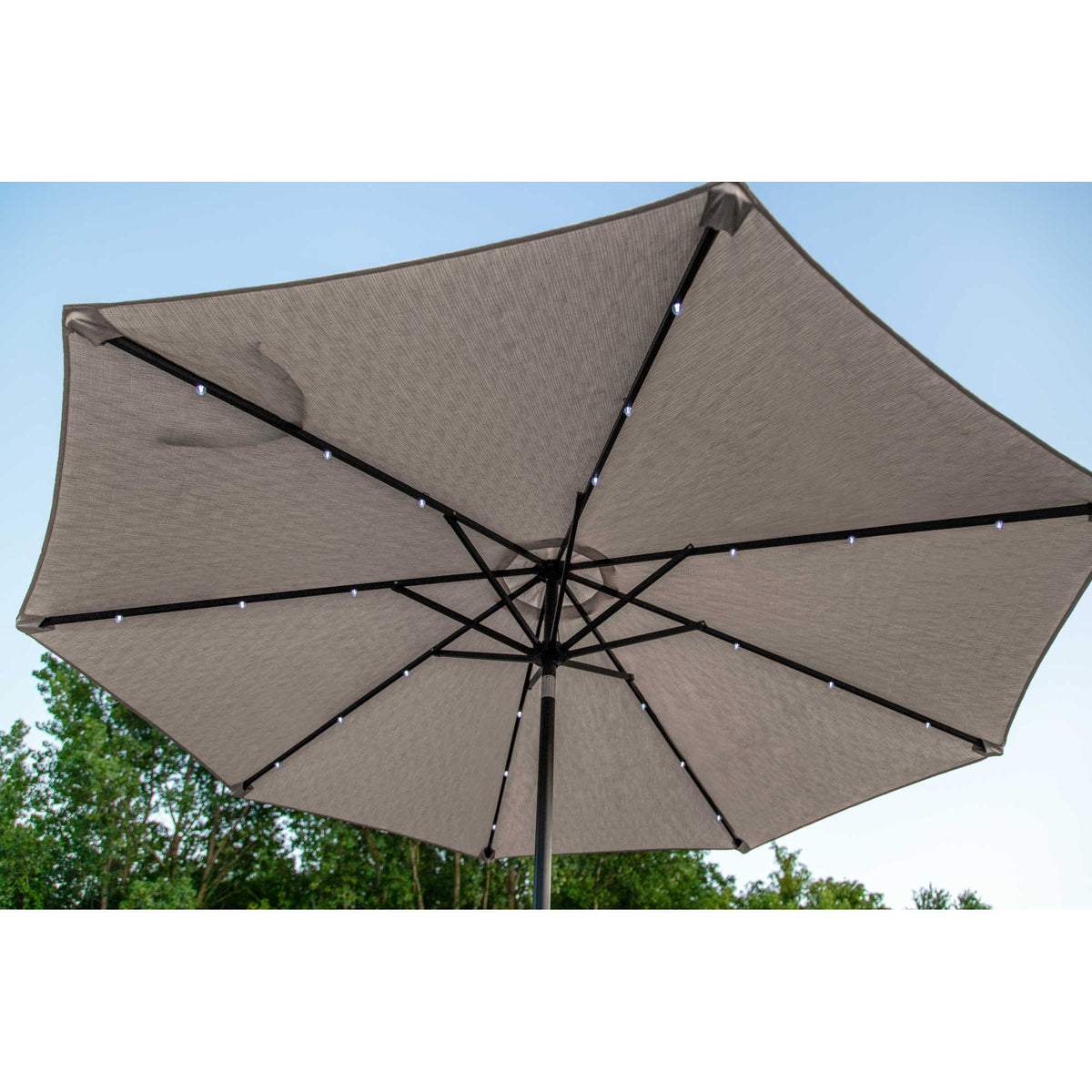 Island Umbrella Mirage Fiesta Umbrella - underside with the solar LED strips lit along each rib