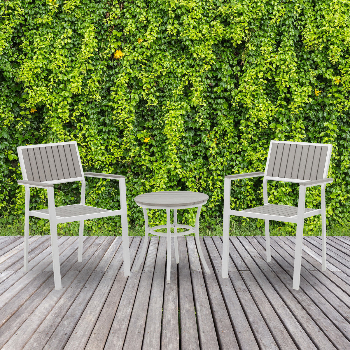 Island Retreat Tek-Wood 3-Piece Patio Set - two chairs and side table on a deck against foliage