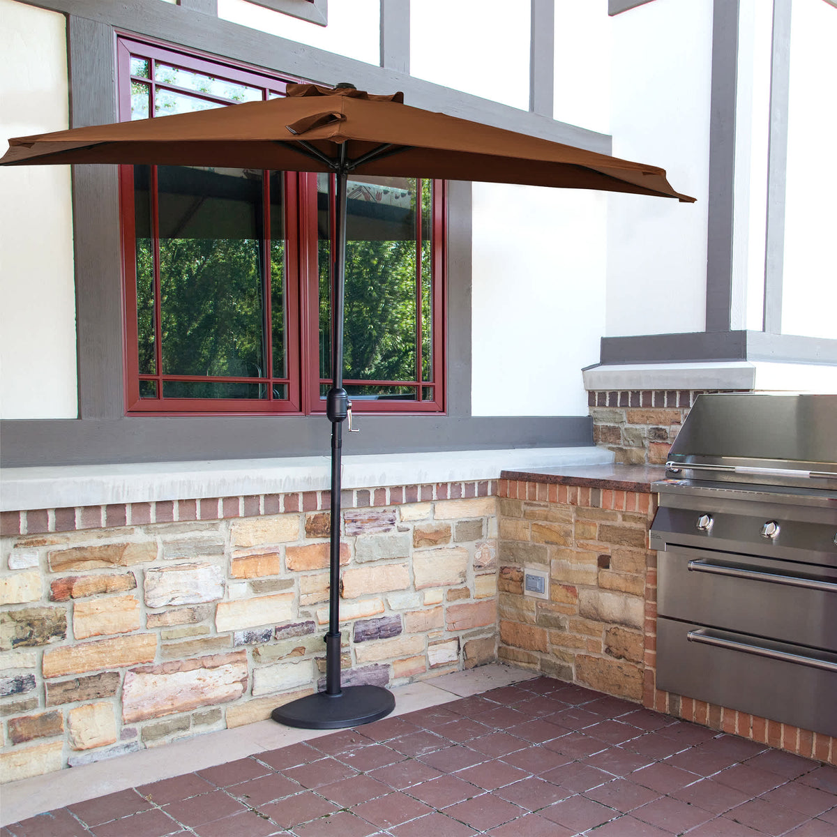 Island Umbrella Lanai Half Umbrella - coffee canopy set flat against a wall by an outdoor kitchen