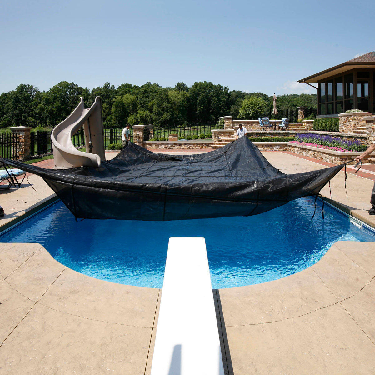Arctic Armor 30-Year Premium Mesh In-Ground Pool Safety Cover w/ Step Section Pool Cover — shown in use (1)