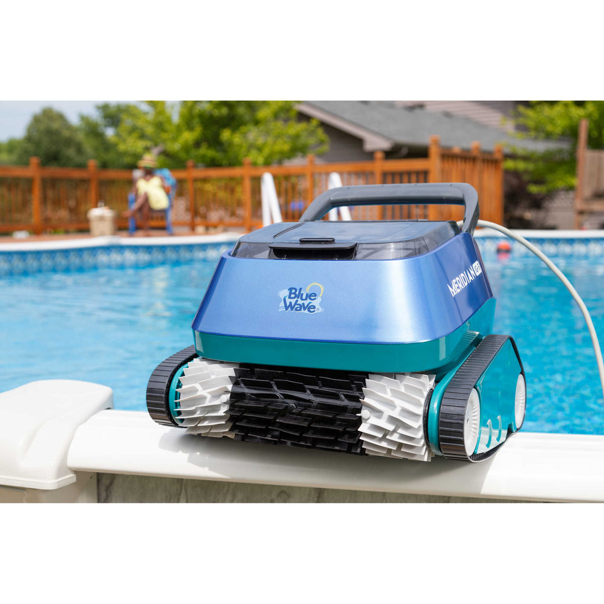 Blue Wave Meridian IG-5 Robotic Cleaner - unit resting on the pool coping with its floating cord