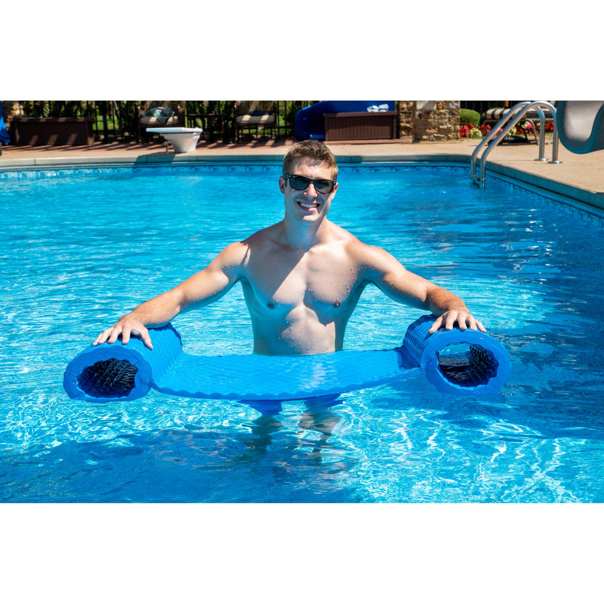 Drift and Escape Luxury Water Hammock - swimmer holding the blue hammock open in a pool
