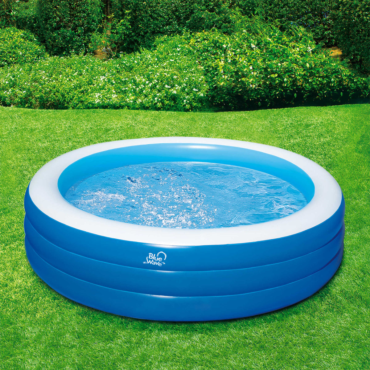 Blue Wave Inflatable Round Family Pool - filled and set up on a lawn, seen from the side