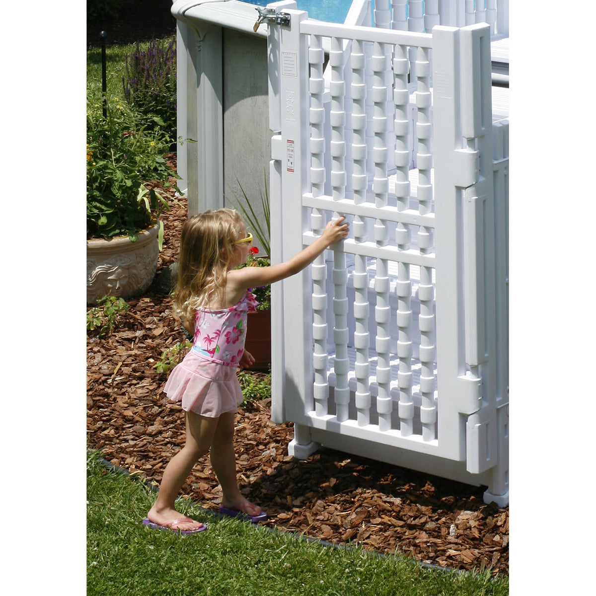 Blue Wave Easy-In Pool Entry System - child reaching for the latched gate at the top of the steps