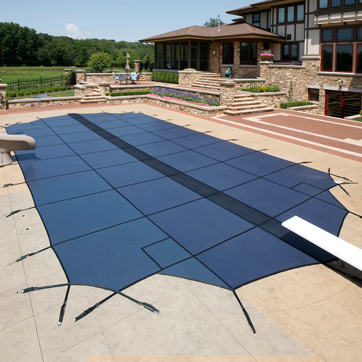 Arctic Armor 20-Year Ultra Light Solid In-Ground Pool Safety Cover with Step Section Pool Cover — shown in use