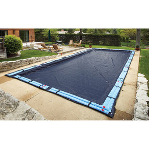 Arctic Armor 8-Year In-Ground Winter Cover - navy cover over a rectangular in-ground pool, held by water tubes