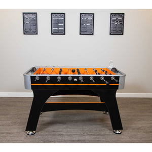 Hathaway Game Rules Wall Art - the four prints hung in a row above a foosball table