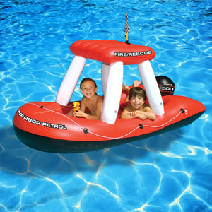 Swimline Fireboat Squirter - two children seated in the inflatable fire boat with the water gun
