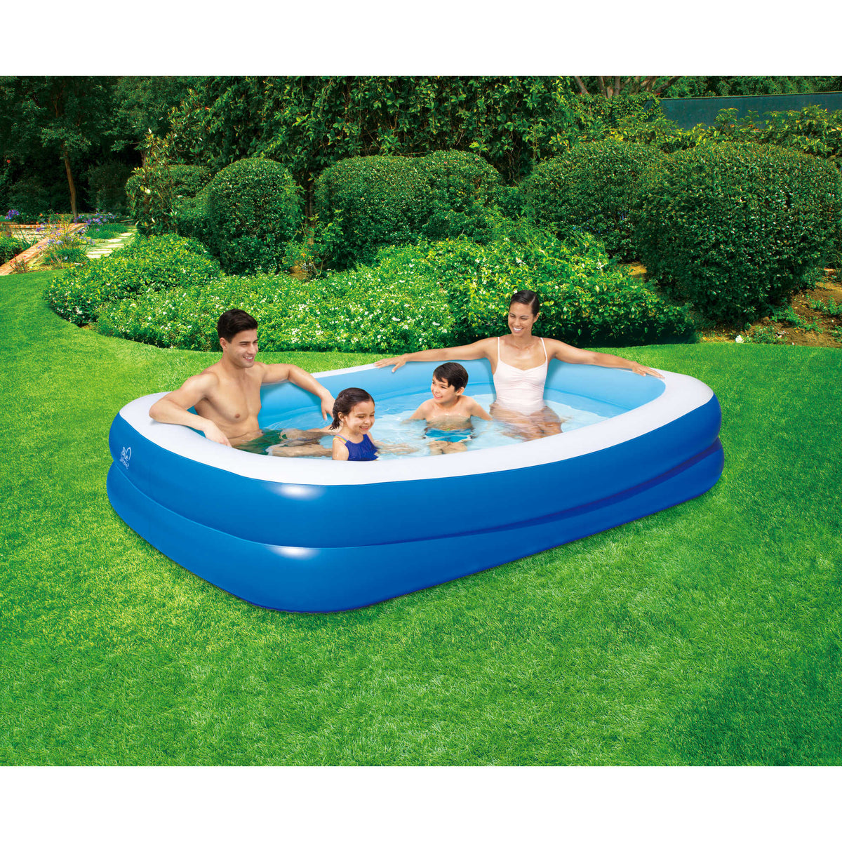 Blue Wave Inflatable Rectangular Family Pool - family seated in the filled pool on a garden lawn