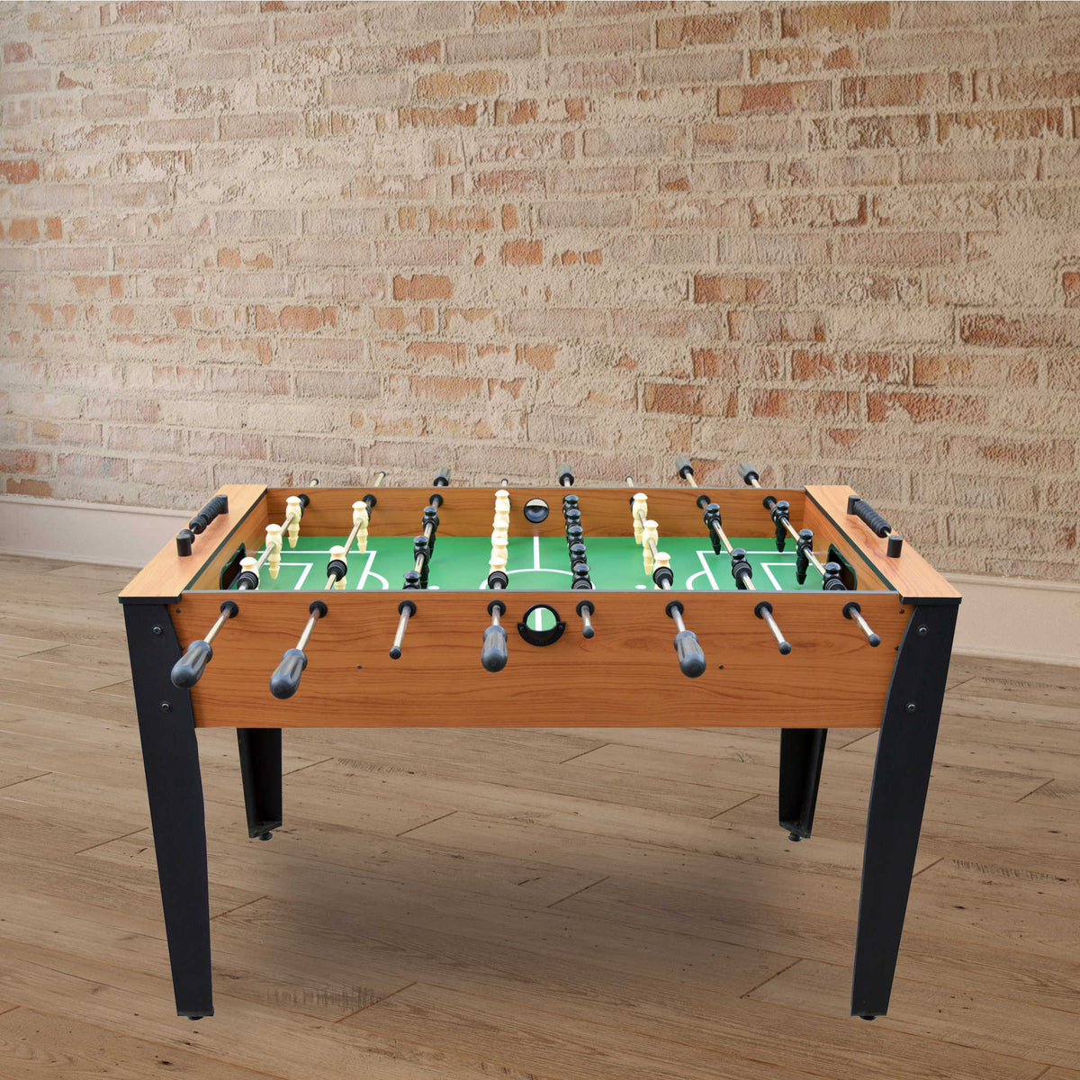 Hathaway Hurricane Foosball Table - table set against an exposed brick wall in a games room
