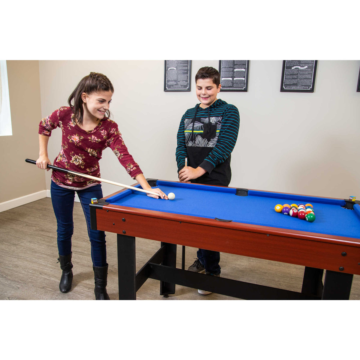 Hathaway Triad Multi-Game Table - two players at the blue pool bed in a games room