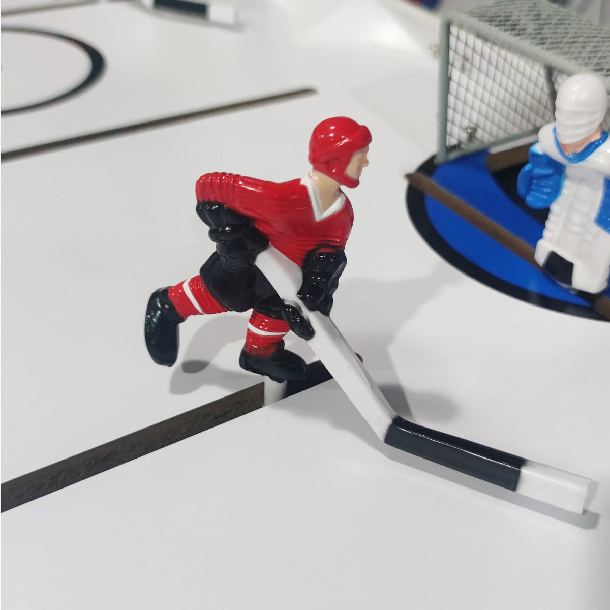 Hathaway Breakaway Dome Hockey Table - red player figure on its rod with stick lowered