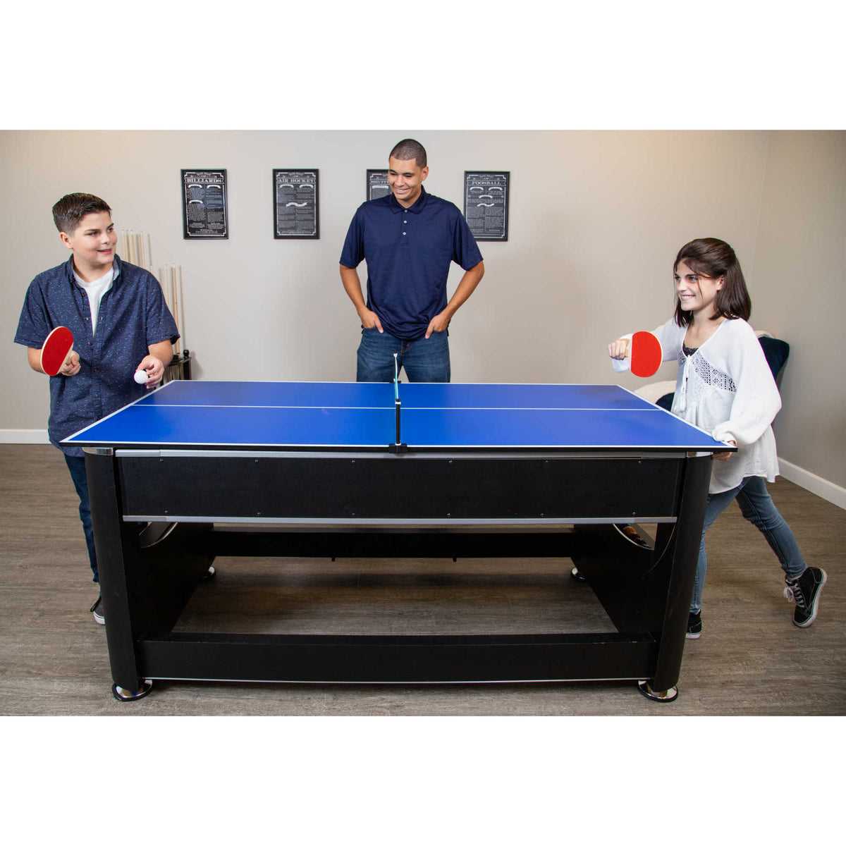 Hathaway Triple Threat Multi-Game Table - three people playing table tennis on the fitted top